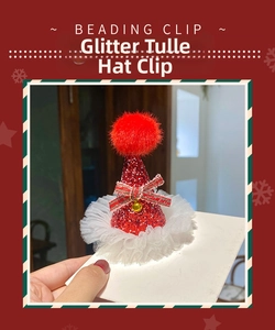 Macro detail of Christmas hat hair clip with red sequins, gold bell and lace tutu