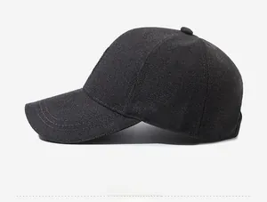 Side view of black baseball cap showing durable textured fabric and six-panel crown