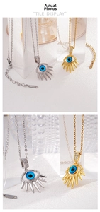 Detailed view of the Evil Eye pendant featuring blue crystal and sparkling accents
