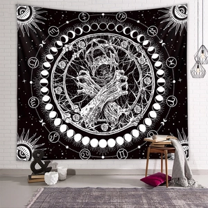 Bohemian skull tapestry with moon phases and zodiac signs on a white brick wall
