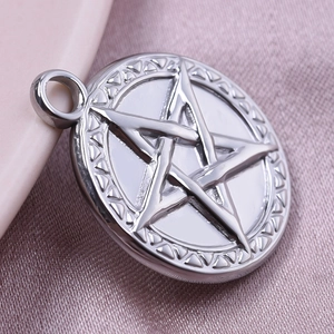 Macro shot of 304 stainless steel star pendant with textured edges on silk