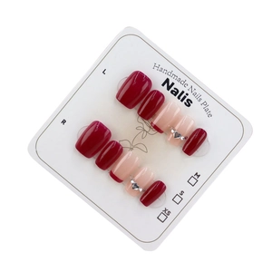 Handmade Bordeaux red press-on nails with silver heart rhinestones and glossy finish