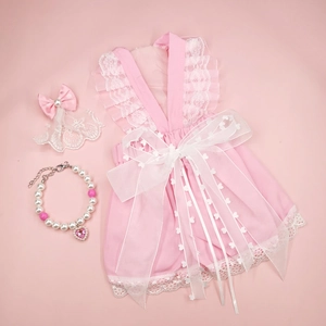 Detailed set of pink lace pet dress with matching bow headband and pearl heart necklace