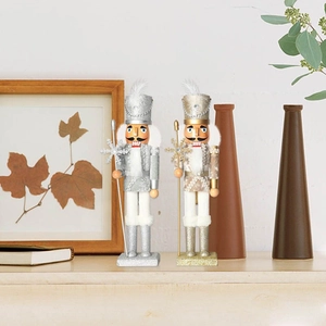 Close-up of 38cm gold and silver wooden nutcracker figurines in a cozy home setting