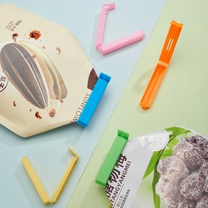 Set of colorful plastic food sealing clips in five vibrant shades for bag freshness