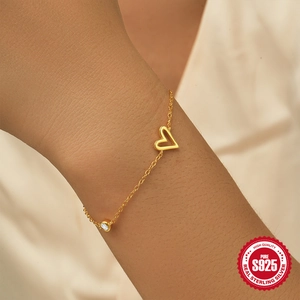 Classic S925 sterling silver heart bracelet with sparkling zircon on a female wrist