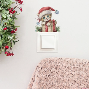 Christmas cat wall sticker with Santa hat and gift box above light switch cover