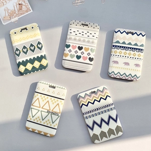 Student ID card holders with geometric and bear patterns in a professional flat lay view