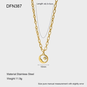 Detail of 18K gold-plated stainless steel necklace with moon and star shell pendant