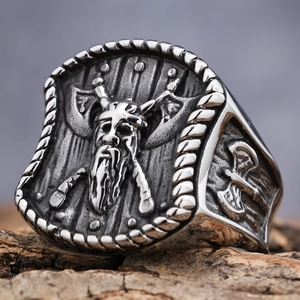 Detailed relief of Viking warrior and axes on two-tone stainless steel ring