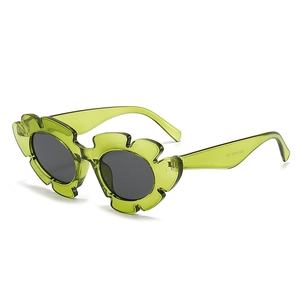 Green flower-shaped jelly frame sunglasses with round grey lenses for trendy women