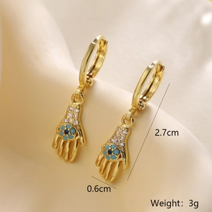 Detailed size view of gold Hamsa hand earrings with blue flower and zircon stones