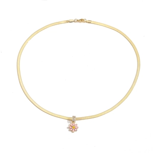 Detailed view of pink enamel daisy necklace with a gold snake chain and crystal accents