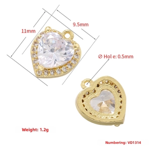 Macro detail of 11x9.5mm 18K gold plated heart pendant with cubic zirconia inlay