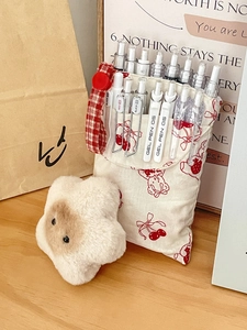 Cream canvas stationery pouch with red cherry patterns and soft star plush keychain detail