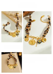 Detailed close-up of sunflower pendant with leopard print fabric and golden chain