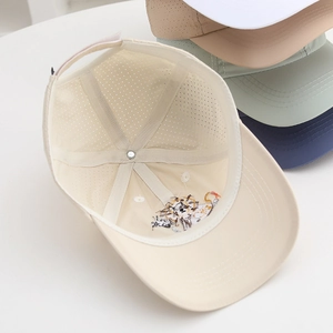 Detailed view of breathable mesh lining and adjustable strap on toddler sun hat