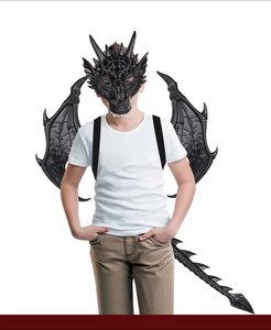 Detailed view of kids dragon costume set with textured mask, wings and spiked tail