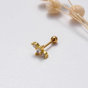 Detailed macro view of gold screw-back stud earring featuring zircon butterfly and stars