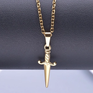 Close-up of golden sword pendant necklace with 18k plating and detailed hilt texture