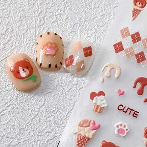 Detailed 5D embossed nail stickers featuring cute brown bears and ice cream cones