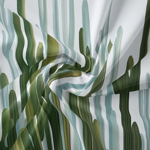 Detail of bohemian tapestry fabric showing tropical cactus print and soft textile texture