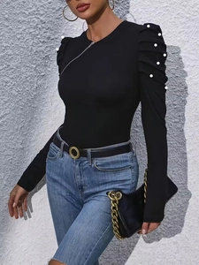 Elegant black puff sleeve top with pearls and diagonal zipper detail for women
