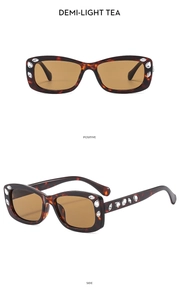 Detail of square demi-light tea sunglasses featuring sparkling rhinestone hinges and temples