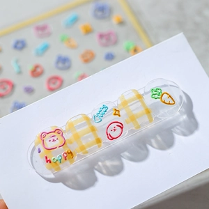 3D embossed nail stickers featuring cute cartoon bears and colorful plaid patterns