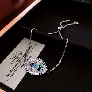 Detailed shot of an evil eye bracelet with colorful zircons and adjustable chain