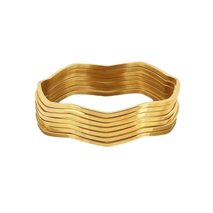 Elegant gold stacked wavy bangle set made of polished stainless steel for women