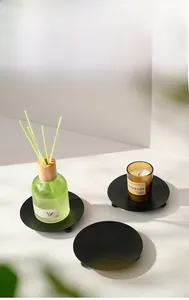 Minimalist matte black metal candle trays with small ball feet for home decor