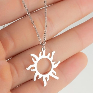 Minimalist silver sunflower pendant necklace with geometric sunburst charm on chain