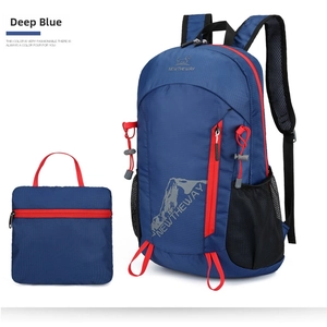 Macro detail of foldable navy blue sports backpack with red zipper and mesh side pocket
