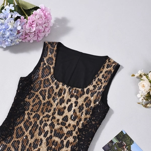 Flat lay of leopard sequin tank top with lace splicing and floral decoration