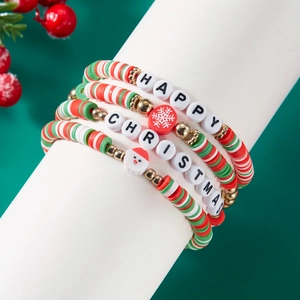 Detail of Christmas beaded bracelet set with Santa charm and Happy Christmas lettering