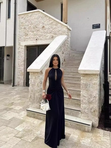 Elegant black halter neck maxi dress with front cutout and ruched slim fit detailing