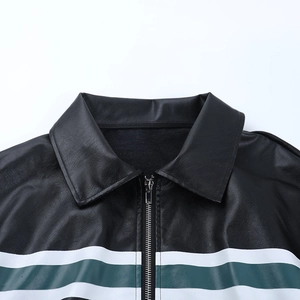 Detailed close-up of vintage leather jacket showing metal zipper and green striped collar
