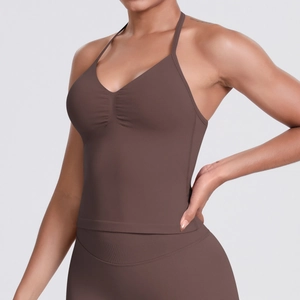 Detail of coffee brown seamless sports top featuring thin straps and ruched chest design