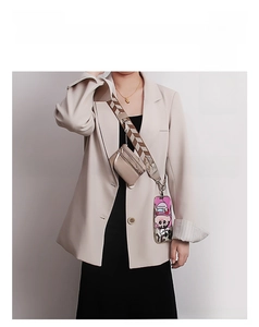Close-up of adjustable wide mobile phone strap with matching zipper pouch and hardware