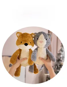 Close-up of soft plush cat and fox dolls showing skin-friendly fluffy long-pile texture