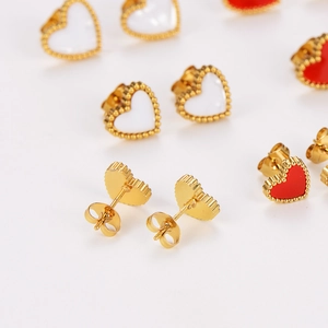 Detail view of colorful heart stud earrings with gold frames and earring back structure