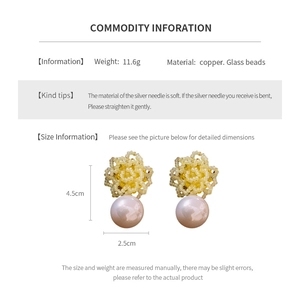 Detail showing floral stud earrings with large pearl pendants and dimension measurements