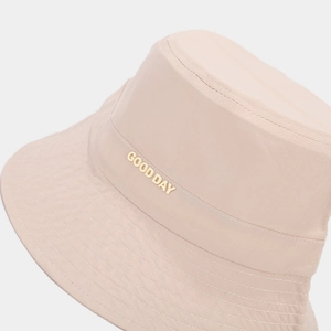 Waterproof beige bucket hat with gold GOOD DAY lettering and reinforced stitching