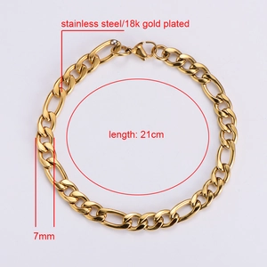 Detail view of 7mm wide 18k gold plated stainless steel Figaro chain bracelet with specs