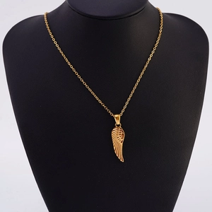 Detailed view of an 18K gold-plated wing pendant necklace on a black mannequin display