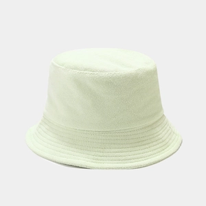 Close-up of soft terry cloth texture on a mint green minimalist bucket hat