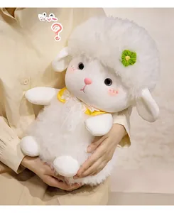Close-up of sheep plush toy showing embroidery face details and floral lace collar