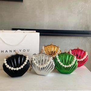 Chic shell-shaped clutch bags with pearl handles in vibrant metallic finish options