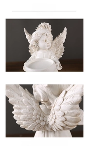 Detail showing the intricate feather texture and ivory resin finish of an angel candle holder